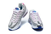Front view of silver Nike Air Max 95 sneakers with pink-accented laces