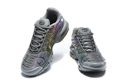 Front and top views of dark grey Nike Air Max Plus sneakers with iridescent accents