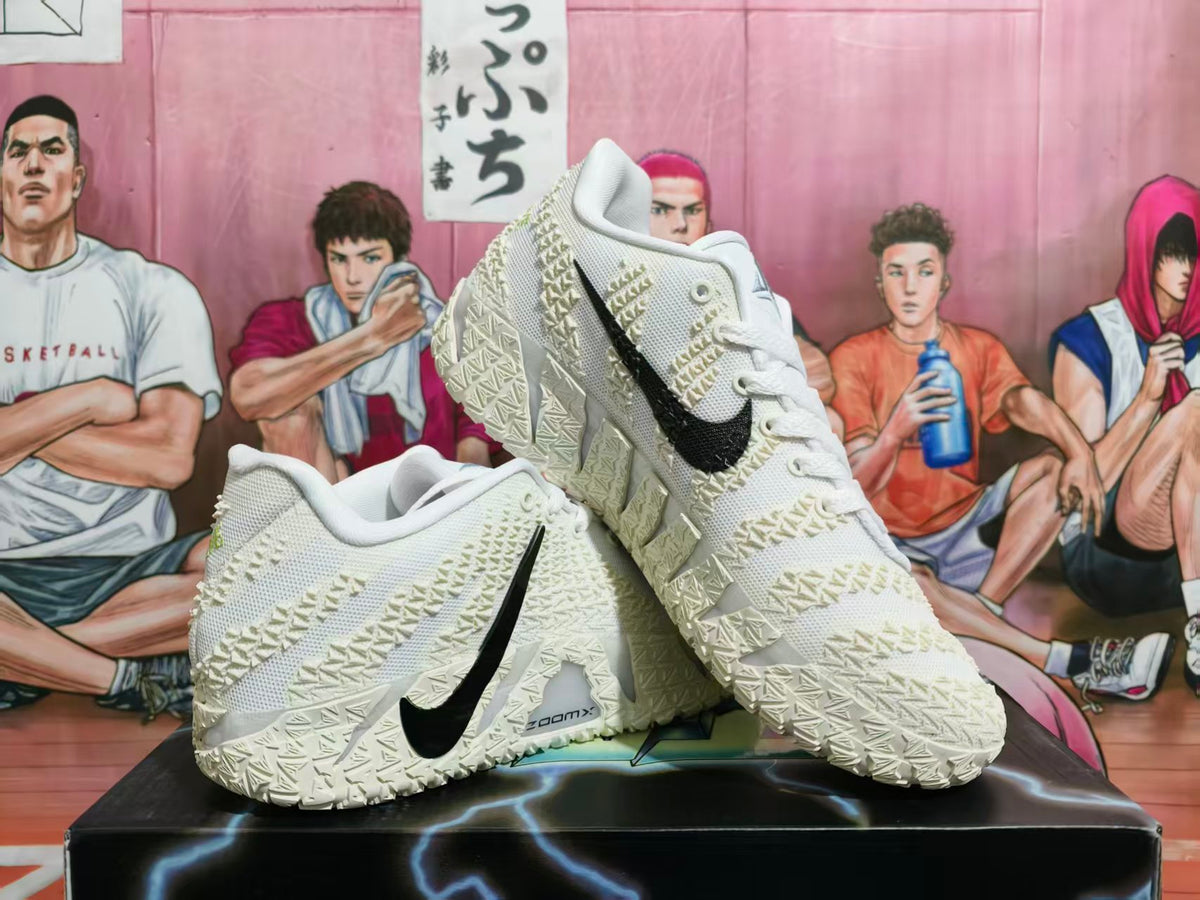 Pair of white Nike Zoom All-Star basketball shoes with black Swooshes and sculpted patterned outsoles.