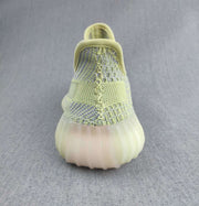 Rear view showing the knit heel construction, padded collar, and translucent sole.