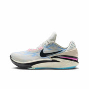 White Nike GT Cut 2 sneaker with pale blue and pink accents, a black Swoosh, and a speckled cream sole.