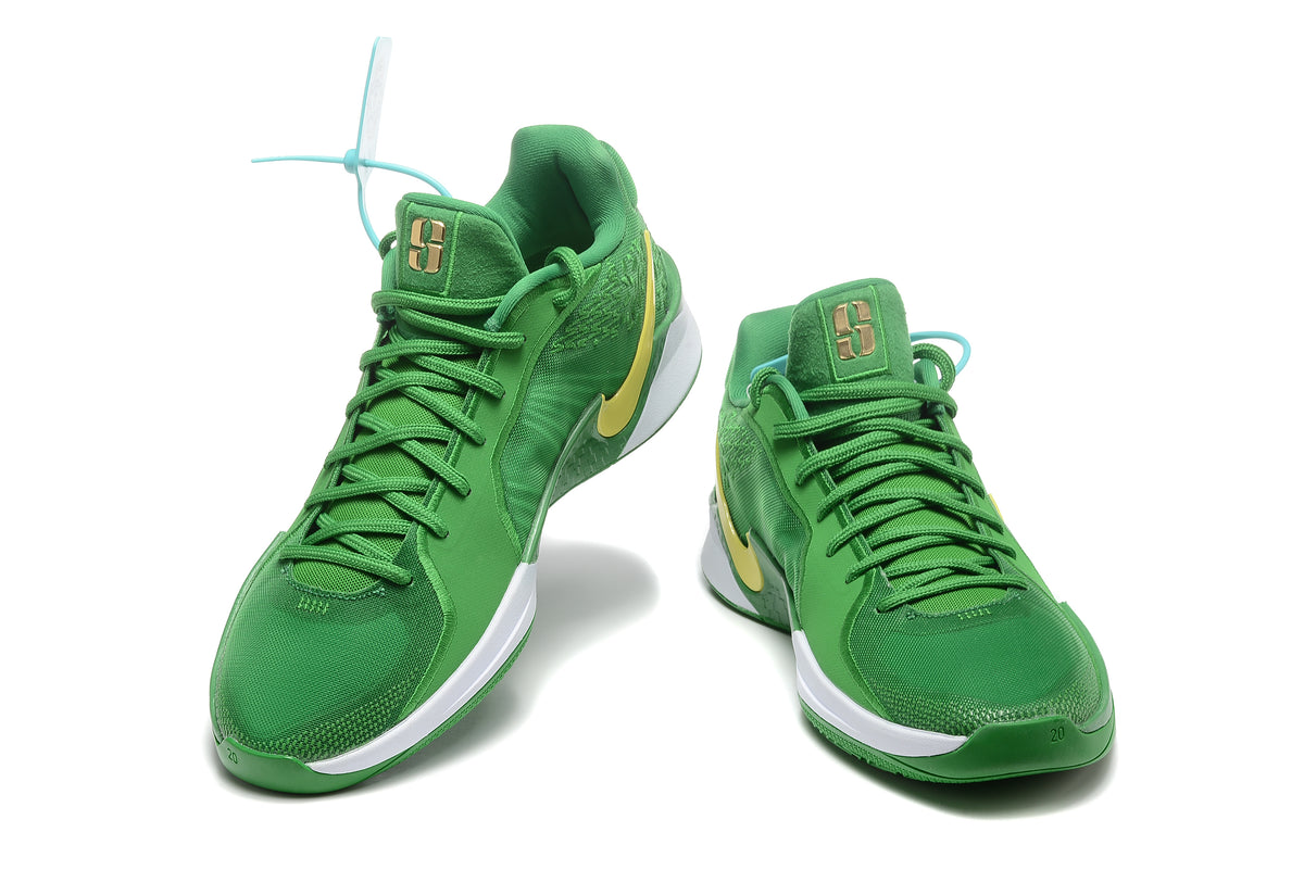 Pair of green Nike Sabrina 2 basketball shoes with yellow Swooshes, viewed from the front.