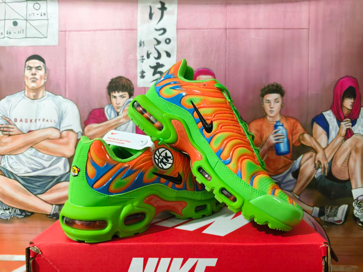 Nike Air Max Plus sneakers in orange, green, and blue displayed on a shoe box