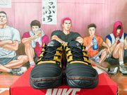 Front view of Nike NDESTRUKT sneakers with black padded toe panels