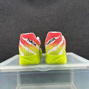 Rear view of the sneakers showing red and yellow gradient panels, white accents, and printed heel branding.