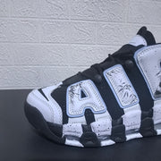 Close-up of the forefoot, laces and AIR lettering on the black and white sneaker.