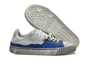 Sneaker outsole and side profile showing the textured tread and sole.