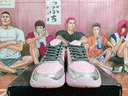 Front view showing perforated pink toe panels, silver toe accents, and dark gray laces