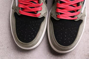 Top view highlighting the black perforated toe boxes, grey overlays, and bright red laces.