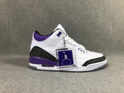 Three-quarter side view of the sneaker with purple detailing and a displayed Jordan hangtag.