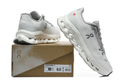 Light gray On running shoes displayed with a Cloudmonster 3 box showing size US 8.5 and UK 7.5.