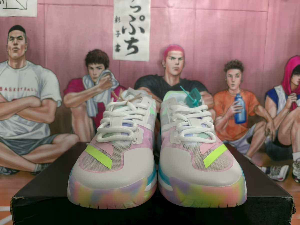 Front view of white basketball sneakers with pastel pink and green details, lime accents, and a chunky multicolor sole