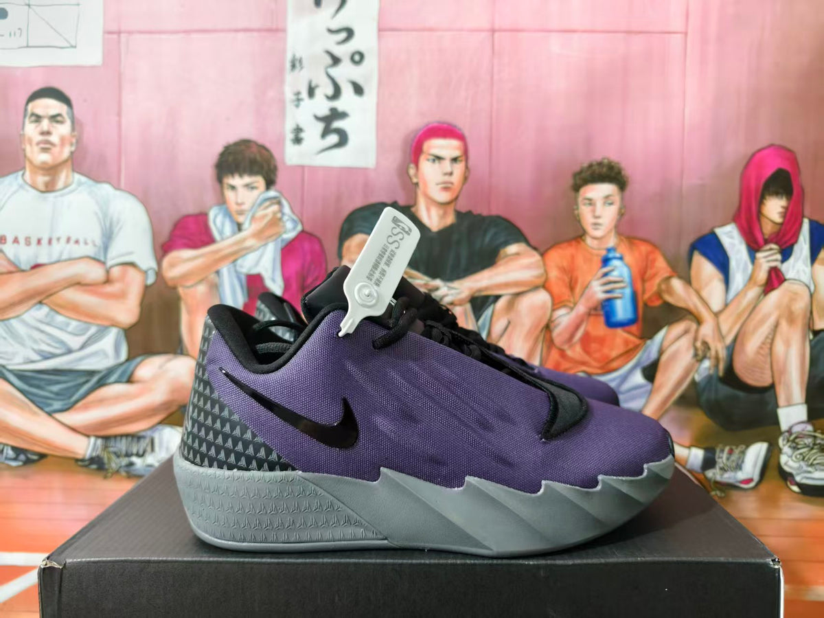 Side view of a purple and black Nike basketball shoe with a gray sculpted sole