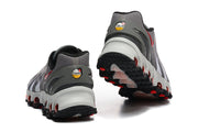Rear view of gray Nike Air Max DN sneakers showing heel details and outsole.