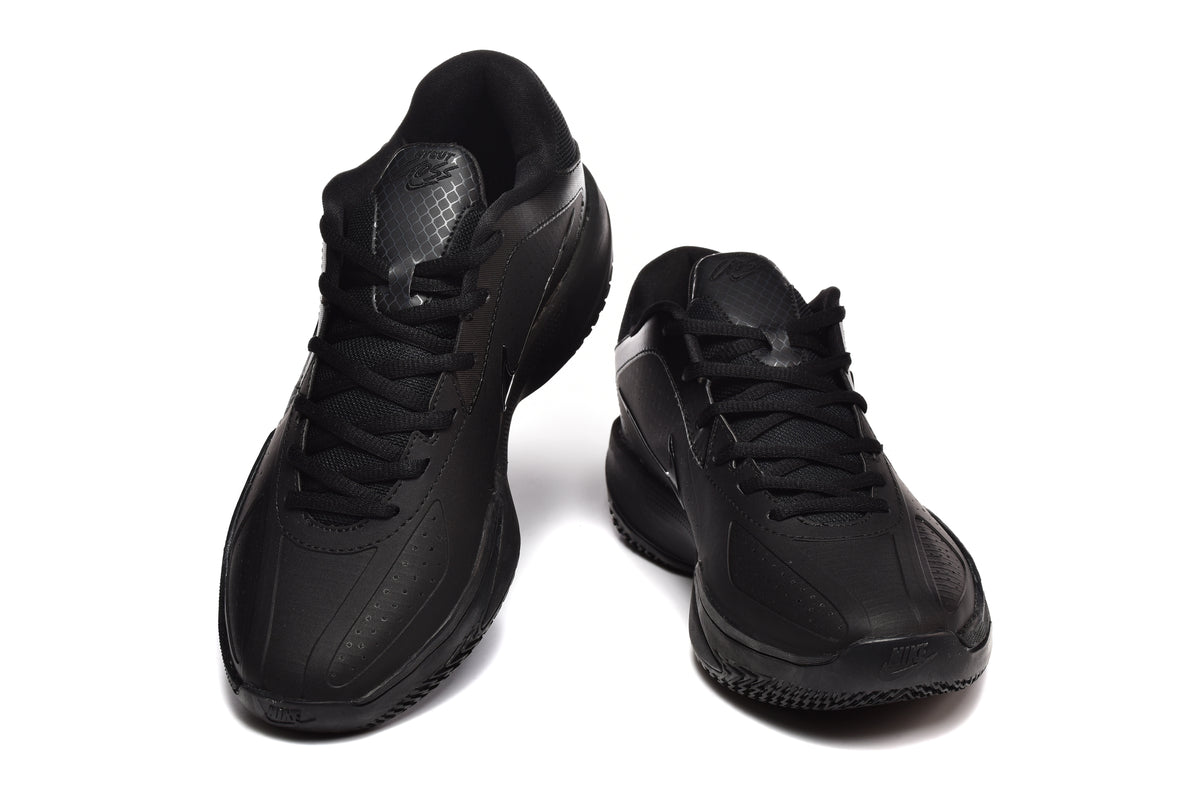 Pair of black Nike basketball sneakers shown from a front three-quarter angle.