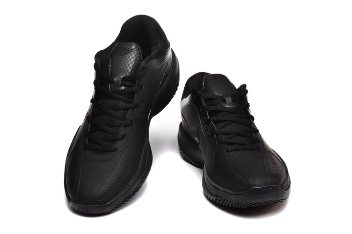 Pair of black Nike basketball sneakers shown from a front three-quarter angle.