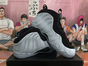 Angled view showing the sculpted white sides and black uppers of the sneakers.