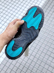 Full outsole view showing bright blue herringbone traction sections within the dark sole.