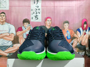 Front view showing the black laces, dark toe panels and green toe outsoles.