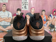 Rear view showing the black collars, striped pull tabs, embroidered tongue details, and white outsoles.