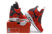 Red and black Nike Air Max 90 SneakerBoot shoes displayed with a box whose label shows size US 8, UK 7, CM 26, EU 41.