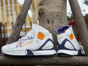 Rear and side views of the shoes showing purple heel trim and orange panels