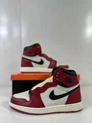 Close side view showing the red overlays, white panels, black Swoosh, and high padded collar.