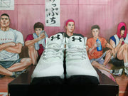 Front view of the pair showing Under Armour tongue logos, white laces and dark outsoles.
