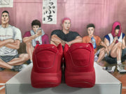 Rear view showing the red heel panels and padded collars of the Jordan sneakers.