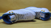 Top-down view of the pair showing the laces, tongues, and gold-tone hardware.