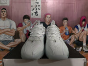 Front view of white and grey Nike LeBron basketball shoes with perforated uppers and white laces.