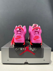 Rear view of the pair showing pink heels, red pull tabs, and Awake NY branding.