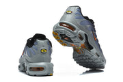 Rear and outsole views of Nike Air Max Plus sneakers