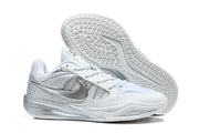 Side and outsole view of the white and silver basketball shoe