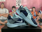 Two blue and black Nike Kobe basketball shoes shown at an angle