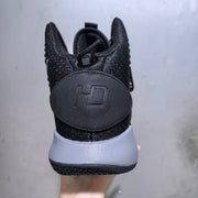 Rear view of the black and grey Nike Hyperdunk sneaker showing the padded heel panel and raised heel detail.