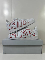 Stacked view of the pair showing the contrasting red-outlined AIR lettering and white low-top construction.