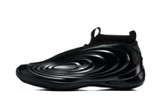Side profile of a black sneaker highlighting the raised oval side detailing and pull tabs.