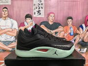 Side profile showing the black upper, pale mint-green midsole and red AIR ZOOM insert.