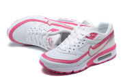 Pair of white and pink Nike Air Max BW-style sneakers shown from above and at an angle.