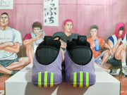 Rear view of the purple basketball shoes with bright green heel accents