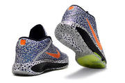 Blue-patterned Nike GT Hustle 3 shoes with orange accents, shown from heel and outsole angles.