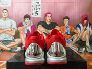 Rear view showing the red collars and reflective-looking heel panels.