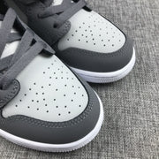 Close-up of both perforated toe boxes with contrasting charcoal overlays and grey laces.