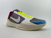 Side view of the shoe with dotted logo and bright laces