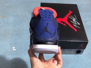 Heel view of a blue sneaker with a Jumpman emblem and white and gray sole