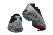 Rear and outsole views of Nike Air Max 95 TT sneakers with visible Air units and red outsole accents.