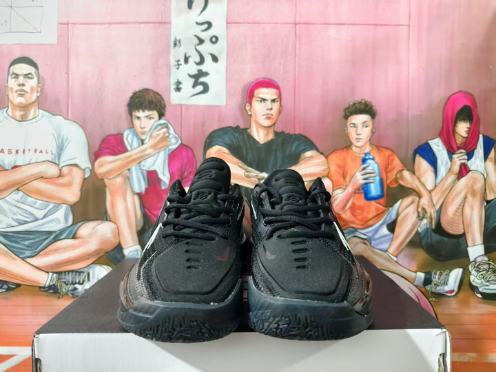 Front view of black basketball shoes with dark laces and subtle Swoosh-style detailing.