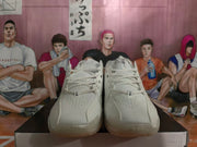 Front view of grey Nike basketball shoes with perforated toe panels and lace-up fastening.