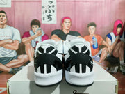 Rear view showing the black-and-white heel design and textured white midsoles.